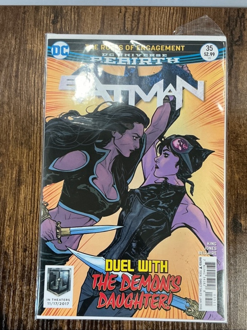 DC Batman Comic Cover with Purple Female Duelists and Orange Background
